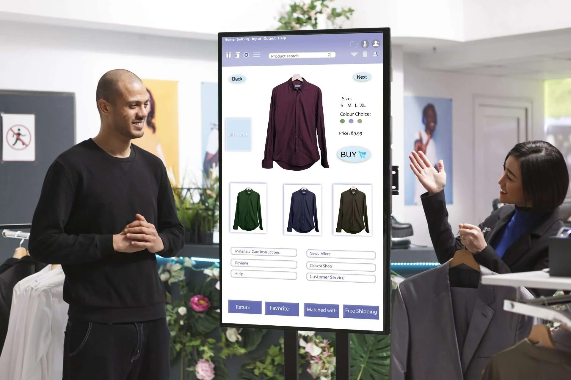 Customers interacting with a large, vertical touchscreen display showcasing men's shirts in a retail store.