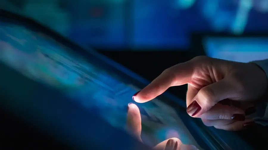 Woman's finger tapping on touch screen